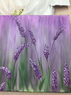 a painting of purple flowers on a canvas