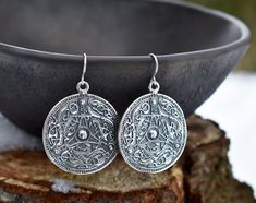 "Handmade sterling silver or 14-K gold-plated sterling silver earrings in form of a Viking shield. Inspired by a find in Sweden, in the 11th century. The same design pendant and earrings in bronze are also available. You can find the here: https://www.etsy.com/listing/1189914979/ If you would like to order these earrings in rose gold plating or made from pure 14-K yellow or rose gold, please, contact us to make a custom order! PRODUCT DETAILS Earrings: -Diameter: 35 mm/ 1.38\" -Drop length: 45 m Viking Shield, Rosé Gold, Bronze Earrings, Pagan Jewelry, 11th Century, Disc Earrings, Gift For Woman, Handmade Sterling Silver, Gold Plated Silver