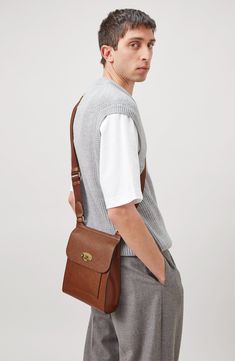 Inspired by traditional postman's bags, this version of the Antony satchel is updated with a slightly larger base for increased capacity. It's crafted from richly grained, vegetable-tanned calfskin that develops character over time, and sports an adjustable canvas strap for shoulder or crossbody carrying. Turnlock flap closure Adjustable crossbody strap Slip pocket beneath exterior flap Unlined Leather Made in Turkey Designer Handbags Classic Everyday Use Saddle Shoulder Bag, Classic Shoulder Bag With Smooth Grain, Classic Flap Shoulder Bag, Classic Saddle Bag With Smooth Grain, Classic Shoulder Saddle Bag With Smooth Grain, Classic Saddle Bag With Smooth Grain For Everyday Use, Classic Canvas Shoulder Bag, Classic Smooth Grain Saddle Shoulder Bag, Classic Everyday Saddle Bag With Smooth Grain