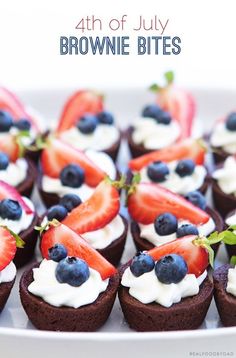 chocolate cupcakes with strawberries and blueberries on top