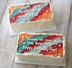 two birthday cakes sitting on top of each other in front of a white wooden table