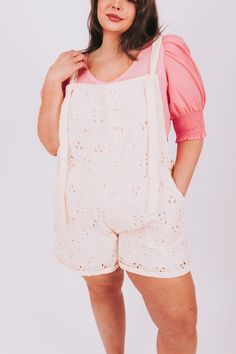 Stay cool and stylish this summer in these PLUS SIZE - Midsummer Dream Overalls. Featuring adjustable tie straps, two front pockets, and a beautiful floral eyelet fabric, these overall shorts will fit comfortably while helping you make a statement. Details Overall shorts Adjustable tie straps Eyelet fabric Pockets! Functional button front closure Functional button side closure Soft fabric Fully lined Sizing Approximate measurements: SIZE LENGTH* INSEAM WAIST 1XL 27” 3.5” 44” 2XL 28” 4” 46” 3XL 2 Summer Beach Shortalls With Pockets, Summer Shortalls For Beach, Summer Beach Shortalls Overall, Sleeveless Summer Shortalls For Beach, Summer Beach Shortalls, Sleeveless Summer Beach Shortalls, Beach Style Summer Shortalls, Cotton Shortalls For Summer Vacation, Spring Beach Shortalls