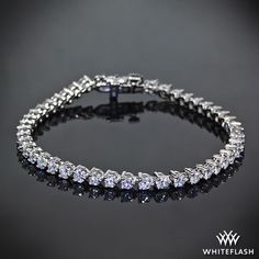 A delicate display of pure brilliance, diamonds are set in a flexible three prong Tennis Bracelet. Dolphin Jewelry, Handcrafted Silver Jewelry, Silver Jewellery Online, Chic Bracelet, Buy Earrings, Diamond Tennis Bracelet, Radiant Diamond, A Bracelet, Buying Diamonds