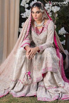 Buy Latest Pakistani Banarsi Gharara Design Dress embellished with sequins, kora dabka, kamdani, stones and silver work Online. Custom Sizes. Fast Shipping White Naqshi Sharara For Reception, Bollywood Style Dress With Naqshi For Traditional Ceremonies, Bollywood Naqshi Dress For Traditional Ceremonies, Pink Naqshi Lehenga, Organza Lehenga With Naqshi For Reception, Organza Sharara With Dabka Work For Traditional Ceremonies, Naqshi Sharara For Reception With Traditional Drape, Traditional Naqshi Sharara For Reception, Pink Naqshi Anarkali Set For Wedding