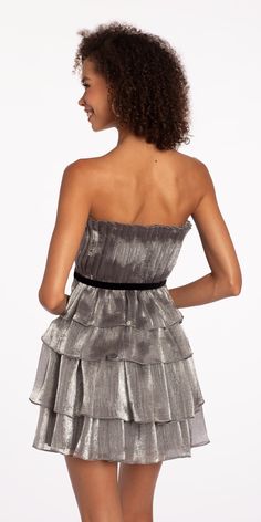 Celebrate your special day in style wearing our Strapless Organza Tiered Fit and Flare Dress. Ideal for cocktails, homecoming, wedding, holiday party or your recent RSVP! Our fit and flare silhouette flatters a range of body types, just view the details: a pleated strapless bodice with velvet waist accent, tiered organza skirt and open back. Complete this playful look with Rhinestone Satin Full Flap Handbag, Grand Fan CZ Drop Earrings, and High Heel Glitter Ankle Strap Sandals. Flirty A-line Strapless Dress For Party, Fit And Flare Strapless Dress For Party, Flirty Strapless Dress With Pleated Bodice For Party, Flirty Evening Dress With Pleated Bodice, Pleated Bodice Mini Dress For Prom Party, Glamorous Party Mini Dress With Pleated Bodice, Glamorous Fit And Flare Mini Dress For Evening, Chic Pleated Bodice Mini Dress For Party, Holiday Wedding Strapless Mini Dress