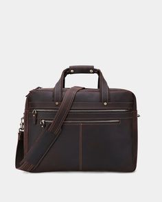 Built to Carry Everything You Need for the Office. THE BRIEFCASE IS THE ULTIMATE IN CLASSIC WORK BAGS. This leather briefcase is a vintage throwback to a time when quality and practicality were key. Made from the finest quality cowhide leather, this men's leather briefcase is professional and mature, yet made to be rugged and hardwearing. It's made so you can make the right impression, yet invest in quality that lasts. Crafted to be Your Monday to Friday Everyday Carry THIS WORK BAG HAS ROOM FOR ALL YOUR GEAR AND MORE. Two extra-large main compartments are ideal for your laptop (up to a 17 inch laptop fits in the padded laptop section), along with gym clothes, books, files, papers, documents and more. Multiple exterior pockets are ideal for accessing the items you need to get to quickly. S Mens Leather Bag Work, Men's Leather Briefcase, Leather Briefcase Bag, Leather Work Bag, Leather Briefcase Men, Luggage Strap, Briefcase For Men, Gym Clothes, Leather Work