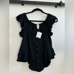 New With Tags -Nwt Never Worn Casual Top, Cotton, Color Black Can Be Worn Off The Shoulder Or As A T Shirt Or Tank Very Cute With Jeans Everyday Sleeveless Tops With Buttons, Sleeveless Tops With Buttons For Everyday, Black Casual Buttoned Tank Top, Casual Black Buttoned Tank Top, Chic Button-up Cotton Tank Top, Black Summer Tank Top With Button Closure, Black Button Closure Tank Top For Summer, Chic Cotton Button-up Tank Top, Casual Ruffle Tank Top