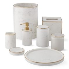 white marble bathroom accessories with gold trim