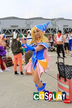 Dark Magician Girl Cosplay from Yu-Gi-Oh! in Summer Comiket 82 2012 Tokyo Blue Fantasy Cosplay Costume For Cosplay Events, Blue Fantasy Cosplay Costume For Events, Anime Style Blue Cosplay Costume, Fantasy Blue Cosplay Costume, Anime Style Costumes For Fantasy Events, Blue Costumes For Comic-con Costume Party, Anime Print Cosplay Costume For Themed Events, Anime Print Cosplay Costume For Cosplay Events, Anime Cosplay Costume For Fan Conventions