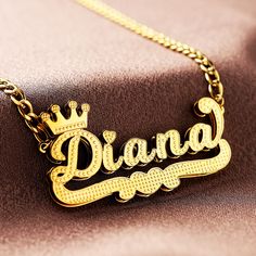 This exquisite double-layer name necklace features a stunning gold-plated name pendant, adding a touch of elegance to any outfit. Each necklace is meticulously handcrafted to order, making it a truly unique and personalized piece of jewelry. **Details - Material: High-quality gold-plated metal - Chain Length: 18in - Personalization: Customize with your name or the name of a loved one - Style: Elegant and timeless, perfect for everyday wear or special occasions This custom name necklace makes a thoughtful and personalized gift for birthdays, anniversaries, or any special occasion. Treat yourself or surprise someone special with this beautifully crafted double-layer name necklace. Gold Name Plate Necklace Crown, Luxury Personalized Custom Necklace With Round Pendant, Cheap Customized Nameplate Necklaces, Cheap Metal Pendant Name Necklace, Cheap Party Nameplate Necklace, Cheap Nameplate Necklace, Cheap Round Pendant Name Necklace For Birthday, Cheap Custom Nameplate Necklaces, Cheap Custom Nameplate Necklace For Birthday