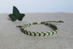 This listing is for one cord bracelet, handmade by macramé, in army green, mint and beige. Perfect jewel for him or for her, comfortable, resistant, to add a boho, surf, modern touch to your outfit! You will recive this bracelet in a beautiful gift packaging ♥ - - - - - - - - - - - - - - - - - - - ▼ Width: approx 6 mm (0.2 inches) ▼ The bracelet has a sliding knot to adjust the length to the size you need. ▼ Made of high quality waxed thread, water and time resistant, doesn't spot nor bleed.  It Green Bohemian Braided Bracelets For Everyday, Everyday Green Bohemian Braided Bracelets, Earthy Handmade Friendship Bracelets, Green Beaded Bracelets With Adjustable Cord For Friendship, Green Friendship Bracelets With Sliding Knot For Everyday, Green Sliding Knot Friendship Bracelets, Everyday Green Friendship Bracelets With Sliding Knot, Casual Green Braided Bracelets For Everyday, Green Sliding Knot Friendship Bracelet