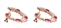 For Sale on 1stDibs - 18 Karat Rose Gold 6.38 Carat Ruby and Diamond Modified Hoop Earrings This exceptional vivid red ruby and invisible set emerald cut diamond modern hoop