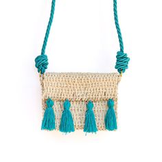 This chic Straw Crossbody Teal bag is great for any occasion. With its unique crossbody style and teal pompoms, it adds a touch of style and personality to any outfit. The lightweight design ensures comfortable and effortless all-day wear. *Each bag is a one-of-a-kind creation, meticulously handmade. Embrace the beauty of imperfection as slight variations in pattern or minor imperfections make every piece special. Own a truly unique accessory that tells a story of craftsmanship and individuality Beach Crossbody Bag With Tassels, Chic Vacation Shoulder Bag With Tassels, Chic Tassel Shoulder Bag For Vacation, Green Tassel Bags For Travel, Green Tassel Travel Bag, Green Travel Bags With Tassels, Turquoise Travel Bag For Spring, Spring Travel Turquoise Bags, Blue Summer Shoulder Bag With Tassels