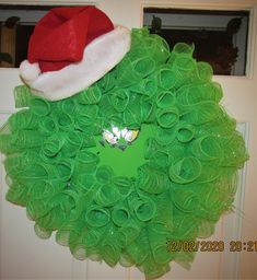 This Grinch Deco Mesh Christmas Wreath in in like-new condition.  The Santa hat makes this Grinch unique from the others.  It measures about 22 inches diameter. It will look great on your door, window or wall. We are a smoke-free and pet-free home. It will be carefully packaged to ensure damage free delivery. Deco Mesh Christmas Wreath, Mesh Christmas Wreath, Deco Mesh Christmas Wreaths, Christmas Mesh Wreaths, Door Window, Door Wreath Hanger, Deco Mesh, Hat Making, Santa Hat