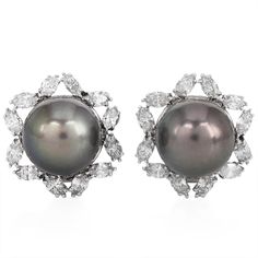 Opulent Estate South Sea Pearl Floral Diamond Earrings, masterfully crafted in 18K white gold. Featuring luxurious 16mm black South Sea pearls with a soft grey hue, these earrings are framed with an exquisite floral halo design of marquise diamonds, adding a dazzling touch of elegance. The 6.00 carats of natural marquise diamonds showcase mesmerizing brilliance, with H-I color and VS-SI clarity, making these earrings perfect for special occasions or upscale evening wear. The secure clip-on closu Marquise Diamond Earrings, Floral Halo, Jewelry Appraisal, Gold Statement Earrings, Sea Pearl, South Sea Pearls, Sea Pearls, Stunning Earrings, Gems Jewelry