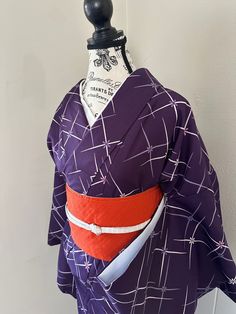 This long traditional kimono is a stunning addition to your wardrobe. Featuring illustration of beautiful color, this kimono captures the elegant spirit of Japan. This kimono is made from fabric that drapes luxuriously over the figure.  Beautiful  cherry flower pattern "komon" kimono is perfect for semi-formal events and other special occasions.   This kimono is in vintage brand new condition (Grade A+). Reversible hanhaba obi is made in polyester and an excellent used condition (grade A) with beautiful cherry flower pattern.   Silk Obijime  is Not included it available for sale at $20. Kimono can be adjusted to fit wide range of sizes.  fits from 0 to 10. Mitake 166cm yuki 68cm Moana 29.5 cm These can be sold separately. kimono $70 obi $45 袷 小紋 桜文様 化繊 名古屋帯  化繊 Hanhaba Obi, Cherry Flower, Traditional Kimono, Vintage Branding, Japanese Kimono, Flower Pattern, Semi Formal, Formal Event, Flower Patterns