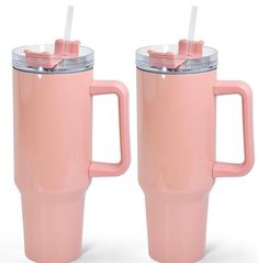 two pink coffee mugs with lids and straws on them are shown side by side