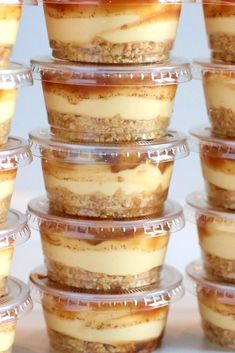 there are many desserts in plastic containers stacked on top of each other, ready to be eaten