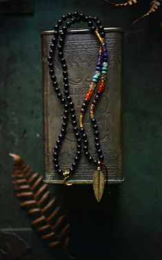 This unisex, smaller bead (6mm) mala necklace is empowering, cleansing and healing in many ways - it has the sacred and special stone combination of all the 7 chakras. Mala is finished with a hand-carved buffalo horn/solid brass feather charm. Truly unique, hip look...! Circumference length of this mala necklace is about 30 inches - it's one of our shorter and lightweight mala styles, made with smaller beads, hand knotted on a durable cord. It's comfortable and easy to wear everyday - last pictu Necklace Knots, The 7 Chakras, Mens Beaded Necklaces, Yoga Necklace, Chakra Yoga, 108 Mala Beads, Chakra Necklace, Chunky Jewelry, 7 Chakra