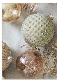 several ornaments are arranged on a table cloth