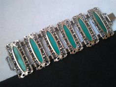 ON SALE Love the look and color of this very wide bracelet. It's one I could just keep. Has such a great Style. It is in very good vintage condition. And measures just over seven and a quarter inches long by 2 and a quarter inches wide. Retro Green Bracelet Jewelry, Handmade Retro Green Jewelry, Mid-century Green Collectible Jewelry, Green Retro Bracelet As A Gift, Retro Green Bracelets For Gifts, Retro Green Bracelet For Gift, Retro Green Bracelets For Gift, Green Art Deco Bracelets As A Gift, Retro Green Bracelet Gift