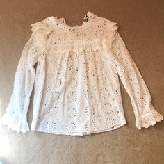 This Is A 100% Cotton Blouse That Is Embroidered With Floral And Geometric Designs. It Is Nwt From Zara In Size Xs. Lovely Off-White With Bib Design, Flared Cuffs, Buttoned In The Back At Top Of Blouse. It Is Supposed To Look “Unfinished” At The Hem, But A Great Boho Piece That I Never Got Around To Wearing, Sadly. Comes With Extra Button! Feminine White Tops For Fall, Spring White Blouse With Ruffles, Long Sleeve Tops With Broderie Anglaise For Spring, White Ruffled Blouse For Spring, White Long Sleeve Tops For Spring, Feminine White Blouse For Fall, Feminine Broderie Anglaise Tops For Spring, Casual Broderie Anglaise Top For Fall, Fall Casual Broderie Anglaise Top