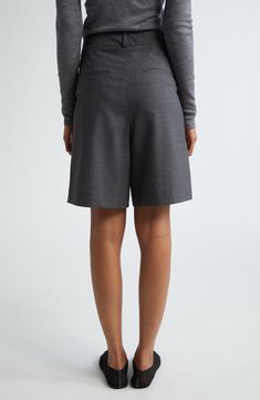 Sun-ready shorts take a sophisticated turn with this pleated virgin-wool pair featuring trim-fit pockets and a roomy wide-leg fit. Zip fly with hook-and-bar closure Front slant pockets; back welt pockets 98% virgin wool, 2% elastane Hand wash, line dry Made in Portugal Elegant Workwear Shorts, Elegant Formal Shorts With Short Inseam, Wide-leg Shorts With Pockets For Work, Wide Leg Shorts With Pockets For Work, Classic Semi-formal Short Bottoms, Tailored Short-length Pants For Workwear, Tailored Short Length Pants For Work, Tailored Classic Shorts For Business Casual, Classic Bermuda Shorts For Workwear