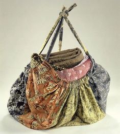 three purses are stacked on top of each other