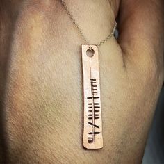 This is a beautiful solid copper pendant which has been hand stamped with your chosen name in ancient Ogham alphabetPLEASE BE AWARE THE ESTIMATED DELIVERY DATE IS GIVEN BY ETSY AND NOT ME AS A SELLER. IT IS JUST AN ESTIMATE AND DOES NOT TAKE ONTO ACCOUNT BUSY PERIODS OR ANY DELAYS THAT MAY OCCUR WHICH IS ENTIRELY OUT OF MY HANDS. Spiritual Hand Stamped Pendant Necklace, Symbolic Copper Pendant Jewelry, Personalized Bronze Pendant Jewelry, Symbolic Hammered Necklaces As Gift, Symbolic Stamped Necklace For Anniversary, Symbolic Hammered Necklace As Gift, Stamped Pendant Jewelry For Anniversary Gift, Symbolic Copper Jewelry Gift, Symbolic Hammered Necklace For Gift