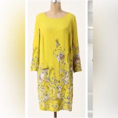 A Gorgeous Yellow With Abstract Floral Print. Just Stunning. Size 2. 38” Long. Sleeves Are 21” Long. Front Pit To Pit Is 16”. 14” Mid Back Shoulder To Shoulder. Back Fabric Overlay. Fabric Content In Pic. So Pretty! No Flaws. Never Worn. Yellow Shift Midi Dress For Spring, Spring Sheath Shift Dress, Shift Sheath Dresses For Spring, Elegant Yellow Printed Dress, Spring Sheath Shift Midi Dress, Spring Sheath Midi Shift Dress, Elegant Floral Print Shift Dress, Elegant Printed Shift Dress, Yellow Sheath Spring Dress