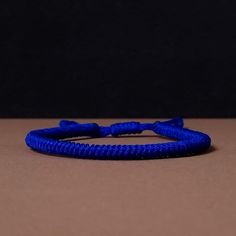 "◾ The handmade navy blue Tibetan bracelet for luck and protection is a beautifully crafted accessory, each knot is meticulously tied whos creates an amazing pattern. ✅ Adjustable bracelet - the slip knot lets you adjust the size. ➰ Sizes: S - Fully Closed - 5.9\"inches (15cm) / Full Opened - 9.8\"inches (25cm) M - Fully Closed - 6.6\"inches (17cm) / Full Opened - 10.6\"inches (27cm) L - Fully Closed - 7.4\"inches (19cm) / Full Opened - 11.4\"inches (29cm) 🟦 The color of the bracelet is navy blue. ◽ More colors and models are available in the shop. ◽ Just check out the shop. ✔️ Please note that due to the difference between different monitors, the image may not reflect the actual color of the item. ✍ If you have any questions please contact me." Blue Casual Bracelet For Meditation, Casual Blue Bracelet For Meditation, Handmade Adjustable Nylon Thread Bracelet, Handmade Adjustable Nylon Thread Bracelets, Adjustable Sliding Knot Nylon Thread Bracelets, Blue Braided Friendship Bracelets, Blue Nylon Cord Friendship Bracelet As Gift, Blue Nylon Cord Friendship Bracelets As Gift, Handmade Blue Braided Nylon Cord Bracelets