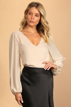 The Lulus Stylish and Sincere Beige Long Sleeve V-Neck Top is always serious when it comes to staying chic! Lightweight woven fabric shapes a V-neckline and back (with a strappy detail), plus a wide-cut boxy bodice. Long sleeves have gathering at the shoulders and elastic cuffs. Fit: This garment fits true to size. Length: Mid-thigh. Size medium measures 23.25" from shoulder to hem. Bust: Great for any cup size. Waist: Not Fitted - comfortable room throughout midsection. Undergarments: May be wo Beige Top Outfit, Office Tops For Women, Spaghetti Strap Blouses, Beige Long Sleeve, Square Neck Bodysuit, Lulu Fashion, White Sleeveless Blouse, Beige Top, Bodysuit Fashion