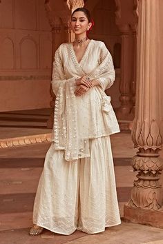 Shop for PREEVIN Off White Cotton Mulmul Mirror And Thread Embroidered Sharara Set for Women Online at Aza Fashions Wedding Cotton Palazzo Set With Traditional Drape, Traditional Drape Cotton Palazzo Set For Wedding, Cotton Sharara With Sheer Dupatta For Wedding, Wedding Cotton Palazzo Set With Gota Work, Cotton Sharara With Cutdana For Wedding, Cotton Palazzo Set With Mirror Work For Wedding, Cotton Cutdana Sharara For Wedding, Wedding Cotton Palazzo Set With Mirror Work, Wedding Cotton Sharara With Cutdana