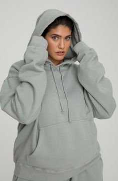 This cotton-knit hoodie offers plush comfort with an oversized fit that covers your backside and extra long sleeves. 27 1/2" length (size 5) Attached hood with drawstring Long sleeves Kangaroo pocket Ribbed accents Allover print 100% cotton Machine wash, tumble dry Made in USA Model stats: 5'10" height, 32" bust, 25" waist, 36" hip. Model is wearing size 5 Comfortable Long-sleeve Hoodie With Drawstring Hood, Cozy Relaxed Fit Hoodie, Long Sleeve Hoodie With Kangaroo Pocket For Loungewear, Comfy Hoodie Sweatshirt With Drawstring Hood, Comfy Cotton Hooded Hoodie, Cozy Solid Sweats With Drawstring Hood, Comfy Cotton Hoodie With Drawstring, Cozy Fit Solid Color Hoodie With Drawstring, Relaxed Fit Hooded Cozy Sweats