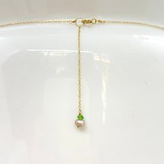 "Wire, Chain & Clasp: 14k Gold Stones: Carnelian Drop (approx. 18mm), Carnelian Bead (approx. 1mm x 2mm), 18k Gold Nugget (approx. 4mm) Necklace Length: approx. 17\" Backdrop: Freshwater Pearl & Tsavorite Backdrop Length: 1.75\" ------------------------------------------------------------ Let me know if you have any questions! *Size adjustable at client's request" Gold Pearl Necklace With Spiritual Gemstone, Spiritual Gold Pearl Necklace With Gemstone, Handmade Yellow Gold Lariat Jewelry, Faceted Yellow Gold Necklaces For May Birthstone, 14k Gold Filled Gemstone Pendant Necklace, Gold Briolette Single Strand Jewelry, Faceted Yellow Gold Jewelry For May Birthstone, Yellow Gold Faceted Jewelry For May Birthstone, May Birthstone Faceted Yellow Gold Jewelry