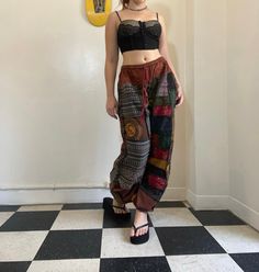 Bohemian mixed patchwork hippie pants in black/ mixed color patches. Each pair is slightly unique and will have some different patches and colorings! Pictures 1-3 are orange, green, and dark blue with mixed patches available in separate listings. Waist stretches from 24-35' inches comfortably. Model is 5'2 for reference. Black Cotton Hippie Pants, Bohemian Baggy Patchwork Harem Pants, Black Bohemian Bottoms For Festivals, Black Bohemian Harem Pants, Bohemian Black Bottoms For Festival, Bohemian Black Festival Bottoms, Bohemian Black Festival Pants, Multicolor Hippie Harem Pants, Hippie Harem Bottoms With Patchwork