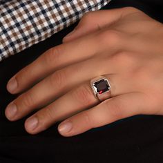 Unleash your inner style icon with our Ruby Silver Ring, a bold and striking jewelry masterpiece. At MyJewelist, we are here to redefine your style, offering you a unique piece that reflects your individuality and adds a touch of cool sophistication to your look. Our Ruby Silver Ring isn't just an accessory; it's a reflection of your distinctive style. When you wear it, you'll radiate confidence and charm, effortlessly grabbing attention wherever you go. ० UNMATCHED COMFORT, IMPECCABLE STYLE ० Concerned about comfort? No worries! Our jewelry is meticulously designed with your comfort in mind. We exclusively use hypoallergenic, nickel-free materials, ensuring you look and feel your absolute best. ० DETAILS ० ★CRAFTED TO PERFECTION: The Ring is a testament to precision and craftsmanship, met Luxury Red Men's Ring As Gift, Modern Red Ring For Formal Occasions, Modern Red Rings For Formal Occasions, Modern Red Open Ring, Modern Red Ring Jewelry, Modern Red Ruby Jewelry, Modern Red Jewelry For Anniversary, Modern Ruby Promise Ring With Polished Finish, Modern Red Gemstone Ring