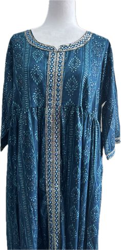 This beautiful blue kurti is made from high quality rayon, making it very comfortable and elegant to wear. The sequins work adds a touch of glamour, while the umbrella cut gives it a trendy and ethnic vibe. The kurti is perfect for casual occasions, offering the perfect blend of style and comfort. It also makes for a great gift for loved ones who appreciate Indian fashion. Add this stunning piece to your wardrobe and make a statement with its vibrant color and unique design.   Garment Sizes: 4XL (48 Inches @ bust)| 6XL (52 Inches @ bust) Fabric: Rayon Fully Stitched *For best fit: Measure your bust size, and purchase an item with a GARMENT BUST size that is 2 inches more. For example, if your bust size is 38 inches, purchase a kurti with a garment Bust size of 40 inches* #Care Instructions Designer Blue Kaftan With Chikankari Embroidery, Blue Printed Kurta Tunic, Blue Printed Tunic Kurta, Blue Festive Kaftan Straight Kurta, Blue Tunic Kurta For Navratri, Festive Bandhani Print Anarkali Kaftan, Festive Blue Straight Kurta Kaftan, Bohemian Bandhani Print Kurta For Designer Wear, Festive Anarkali Kaftan With Bandhani Print