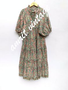 ITEM DESCRIPTION red green floral printed women's maxi dress - V neckline with frill collar summer long dress - 3/4th sleeves boho dress  Features: 3/4th sleeve, V neck, Long dress Fabric : 100% Cotton cambric hand block printed fabrics  Sleeve Length = 18 inch For more sizes & their measurement, please refer our below chart to understand the sizes variations available with us For your size requirement, please mention your size in seller note at the time of buying. SIZE MEASUREMENT  BUSTLENGTHSH Flowy Green Printed Floral Dress, Green Boho Print Maxi Dress For Spring, Spring Green Boho Print Midi Dress, Green Boho Print Midi Dress, Green Bohemian Short Sleeve Midi Dress, Bohemian Green Midi Dress With Short Sleeves, Green Boho Print Short Sleeve Maxi Dress, Green Printed Maxi Floral Dress, Green Boho Print Maxi Dress With Short Sleeves