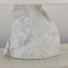 a large rock sitting on top of a wooden table