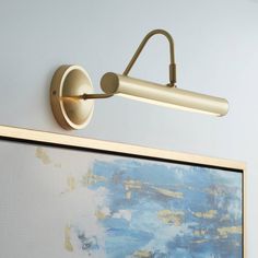 a wall light mounted on the side of a painting