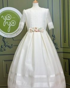 Almendro is an elegant communion dress for girls, made with an off-white fabric. The pink bow on the back is an appliqué, which can be removable. Made in Spain Does not include crinoline Dry clean Final Sale, no exchanges nor returns will be accepted Holy Communion Dresses, First Communion Dress, Spanish Fashion, Communion Dresses, Dress For Girls, First Holy Communion, Holy Communion, Dress Plus Size, First Communion