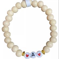 Wooden Beaded Bracelet Initial A. Stretchy. Stackable New With Tags White Stretch Bracelet With Round Wooden Beads, Casual White Jewelry With Wooden Beads, Beige Bracelets With Wooden Round Beads, Beige Wooden Beaded Bracelets, Casual White Stretch Bracelet With Wooden Beads, Handmade Casual Cream Jewelry, White Wooden Beads Stretch Bracelet Gift, White Wooden Beads Stretch Bracelet As Gift, White Stretch Bracelet With Wooden Beads For Gift