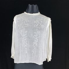 "This is a true Victorian blouse made of white lawn cotton fabric that is light as air. Embroidered ribbon motif and small round holes  decorate down the front with tucks at the shoulders and open cut work on the 3/4 sleeves that finish with lace.  The most important measurement on  Victorian clothing is the shoulder and length. Modern bodies are just larger than 100 years ago. This blouse is very roomy in front to fit 50\" but the back fits size 38\" bust. Length is 21\" but the waist should be M Embroidery, Victorian Skirt, Victorian Blouse, Embroidered Ribbon, Gibson Girl, Victorian Clothing, Hem Blouse, 100 Years Ago, Vintage Blouse