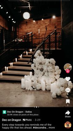 an image of candles on the ground in front of stairs