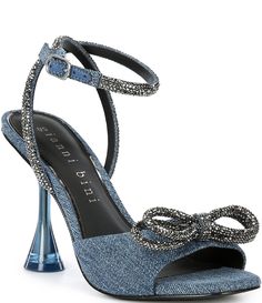 From Gianni Bini&#x2C; the Haydn Denim Rhinestone Bow Ankle Strap Dress Heels feature:Denim fabric upperRhinestone detail on straps and bowAnkle strap with buckle closureSynthetic lining4mm padded memory foam sockSynthetic outsoleApprox. 3.94" heel heightImported. Denim Ankle Strap Heels For Parties, Denim Heels With Ankle Strap For Party, Chic Party Denim Heels, Summer Evening Denim Heels, Homecoming Heels, Denim Rhinestone, Denim Heels, Dress Heels, Rhinestone Heels