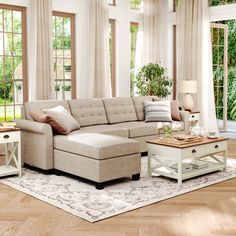 a living room filled with furniture and lots of windows