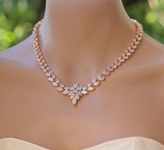 "Rose Gold 'Colette' bridal necklace is made with stunning marquise cut and teardrop crystals, and is completed with a starburst of crystals at the center. Colette has the most gorgeous sparkle and will add an elegant and very sophisticated touch to your wedding day jewels. Perfect if you are wearing a strapless dress! Measures: L = 16\" (40.5 cm) with an optional 2\" extender. Width = 1cm Center piece = 3cm long Highest quality cubic zircons set in tarnish resistant 16K Rose gold plate for heir Rose Gold Jewelry Necklace, Crystal Wedding Necklace, Promise Necklace, Gold Bridal Necklace, Diamond Necklace Designs, Bridal Necklace Set, Necklace Rose Gold, Rose Gold Bridal, Diamond Necklace Set