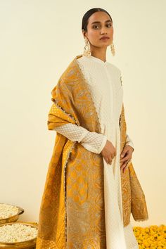 Glaze mustard dupatta with Kashmiri tilla embroidery in floral, paisley motifs and bead work hem.
Component: 1
Pattern: Embroidered
Type Of Work: Tilla
Fabric: Raw Silk
Color: Yellow
Other Details: 
Note: Kurta and pant worn by the model is not for sale
Occasion: Wedding,Mehendi - Aza Fashions Anarkali Dupatta With Intricate Jamawar Embroidery, Yellow Salwar Kameez With Intricate Embroidery, Designer Yellow Anarkali Set With Intricate Embroidery, Gold Jamawar Dupatta With Intricate Embroidery, Jamawar Chandbali Dupatta With Intricate Embroidery, Yellow Anarkali Kurta With Intricate Embroidery, Festive Yellow Kurta With Intricate Embroidery, Yellow Raw Silk Dupatta With Dabka Work, Yellow Raw Silk Dupatta With Dabka Embroidery