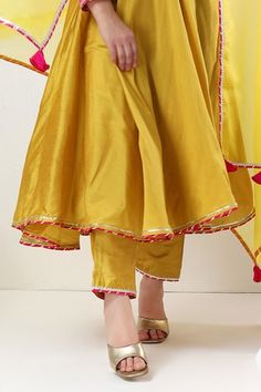 Yellow cotton silk anarkali with gota lace embroidery. Comes with pant and an organza dupatta. - Aza Fashions Anarkali Sharara With Embroidered Border In Slub Silk, Yellow Chanderi Palazzo Set With Embroidered Border, Cotton Silk Sharara With Embroidered Border For Festivals, Festival Cotton Silk Sharara With Embroidered Border, Diwali Slub Silk Anarkali Set With Embroidered Border, Yellow Anarkali Palazzo Set With Embroidered Border, Bollywood Style Sharara With Embroidered Border, Yellow Embroidered Palazzo Set For Festivals, Cotton Silk Anarkali Set With Embroidered Border